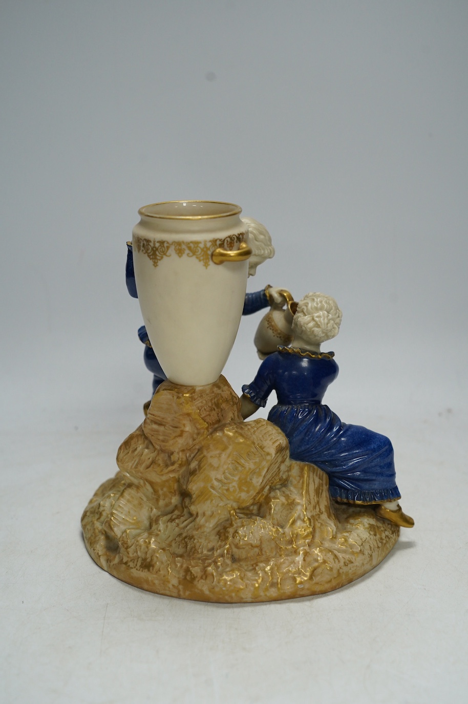 A Worcester figural bud vase, 313, signed Hadley, 17cm high. Condition - good